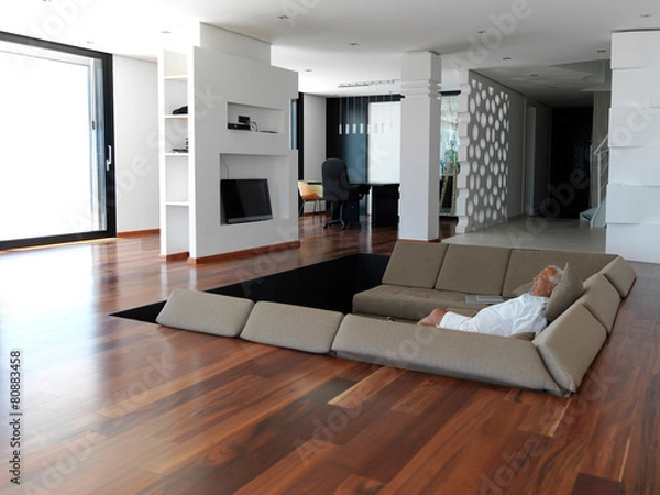 Fototapeta Portrait of senior man relaxing in sofa