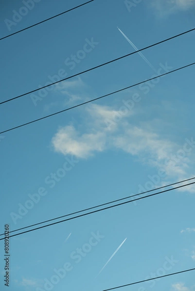 Fototapeta Skyline with Power Lines and Contrail