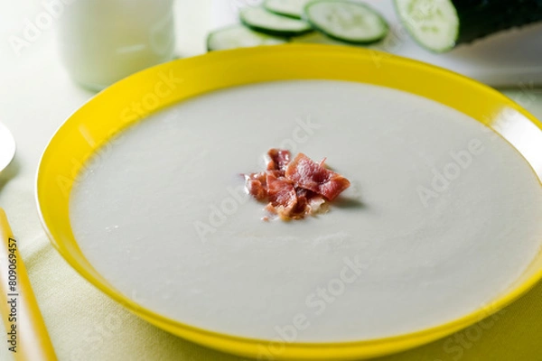 Fototapeta cold cucumber yogurt soup in yellow plate