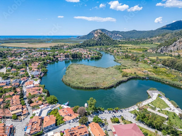 Obraz you can see the kaunos king tombs in dalyan by boat in the water canal, you can wander around the caretta turtle breeding areas on iztuzu beach.
