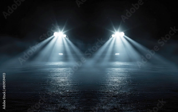 Fototapeta The car's headlight blinks in the darkness, showing the switch of LED headlights on a sports car at night