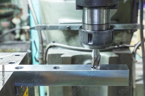 Obraz Tapping metal box by machine