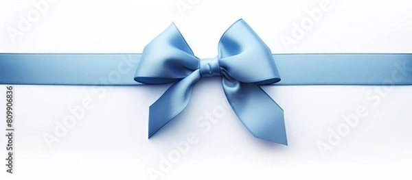 Fototapeta A blue gift ribbon with a parallel ribbon forming a bow on a white background The image has copy space