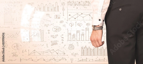 Fototapeta Businessman with diagrams and graphs