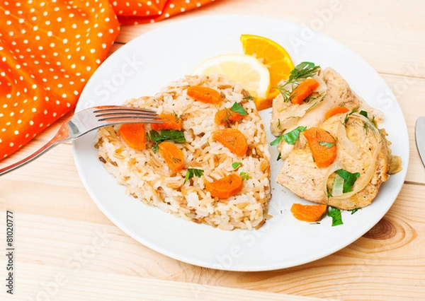 Obraz fried chicken with rice in white plate on wooden table