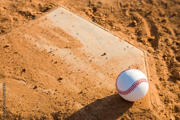 Obraz Baseball Sitting on a dirty homeplate.