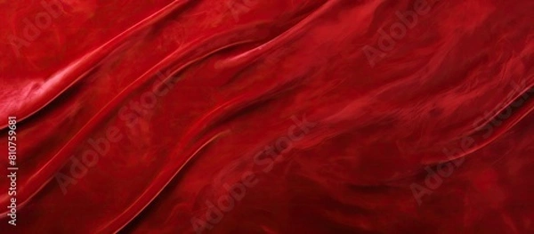 Fototapeta A top view of a red velvet texture with a white background provides a close up perspective for a copy space image