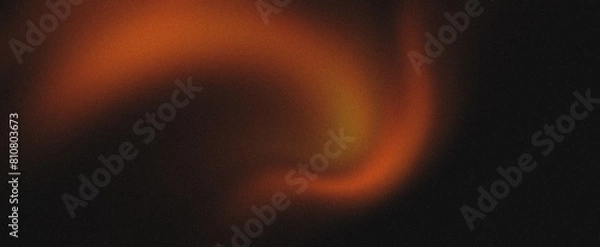 Fototapeta Orange glowing color gradient on black grainy background, noise texture effect, large banner copy space,Orange black colors gradient background, grainy texture effect, web banner design.