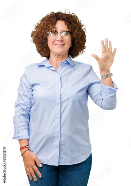 Fototapeta Beautiful middle ager senior businees woman wearing glasses over isolated background showing and pointing up with fingers number five while smiling confident and happy.