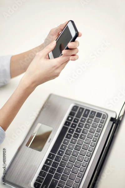 Fototapeta close up of woman texting on smartphone at office