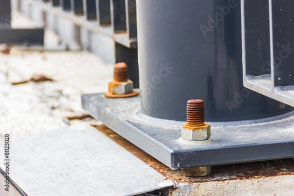 Obraz Dark metal column with bolts