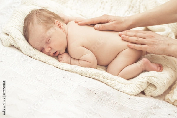 Obraz Mother massaging infant boy