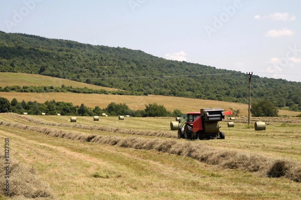 Fototapeta Tractor on field