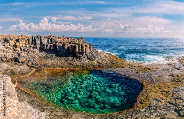 Fototapeta Discover the natural pools at Caleta de Fuste, Fuerteventura: an oasis of calm with crystal-clear waters, framed by volcanic cliffs and idyllic landscapes.