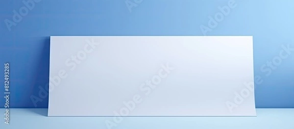 Obraz Geometrically positioned empty paper with a plain color background ideal for presentations and with ample room for additional visuals or text creating a copy space image