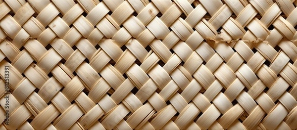 Fototapeta Vintage wooden bamboo weave background with garlic cloves providing ample copy space image