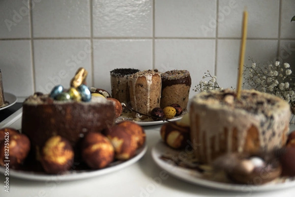 Fototapeta easter cake with chocolate and eggs on a white plate