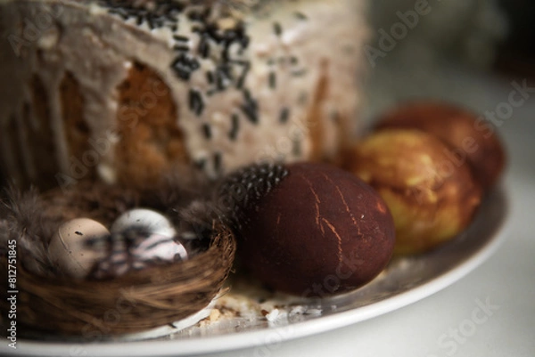 Fototapeta easter cake with chocolate and eggs on a white plate