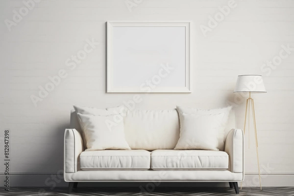 Fototapeta Living room with a black and white framed picture on the wall. The room is sparsely decorated.