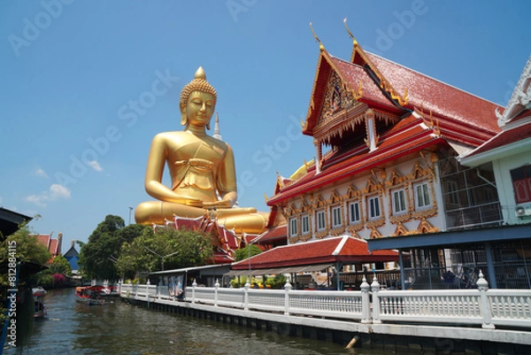 Obraz Big Golden Buddha Statue in Wat Pak Nam Phasi Charoen or Pak Nam Temple - It is famous for its large seated Buddha that is the largest in Bangkok Thailand - Travel Sculpture and Architecture Religion 