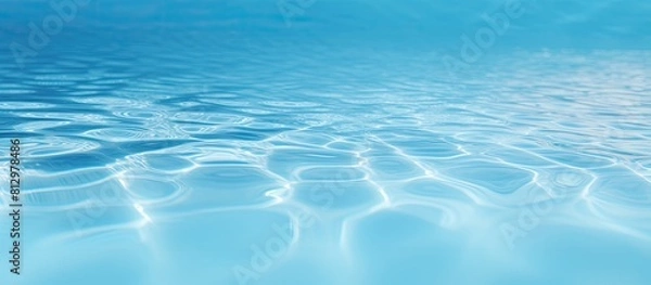 Fototapeta A clear blue swimming pool s close up with copy space image