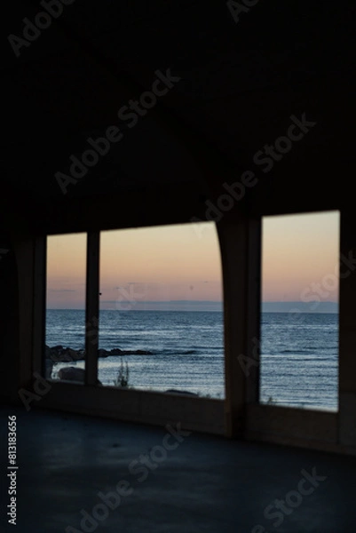 Fototapeta window joinery - a beautiful view with the reflection of the sunset