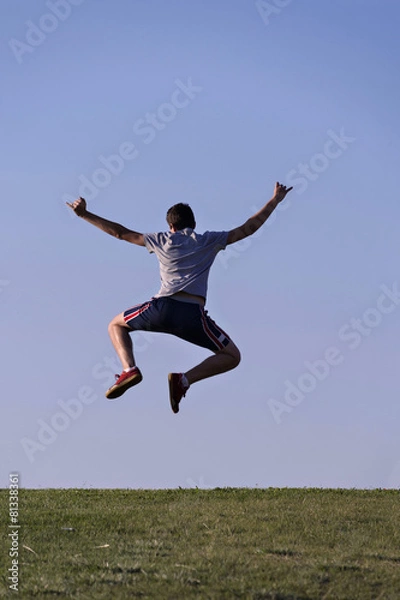 Obraz Man jumping on the field
