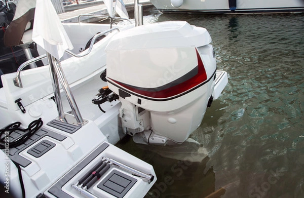 Fototapeta The rear part of a modern speedboat with an engine. Modern vessel.