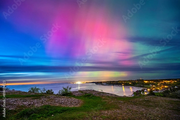 Fototapeta Northern light dancing over the Baltic sea at island of Gotland.