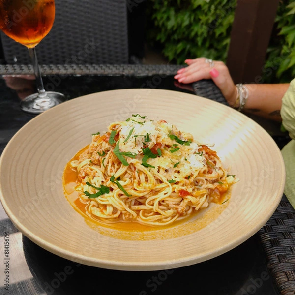 Fototapeta Plate of crab linguine garnished with parsley.