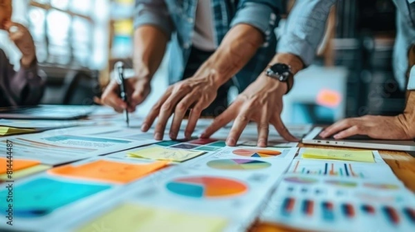 Fototapeta Business leaders engage in a strategic planning session, discussing long-term objectives and conducting a PESTLE analysis to assess external factors impacting their industry. Their forward-thinking