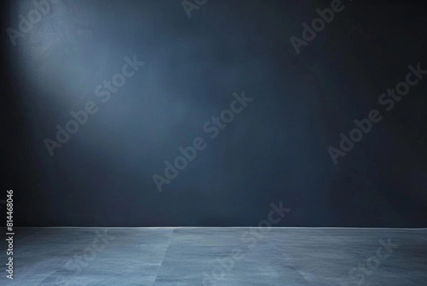 Fototapeta A minimalist dark blue studio backdrop with a smooth gradient, complemented by a neutral grey floor, offering ample copy space for design or text  