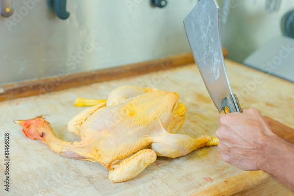 Fototapeta Butchering a chicken