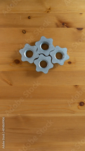 Fototapeta Symmetrical Gears on Polished Wood