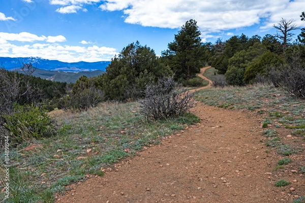 Obraz winding hiking trail with a view of the range and cloudy sky