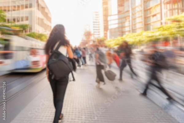 Fototapeta blurred for background. Crowd of people on the street. people walking on the city street. A blurry people walking. Urban, social concept. Abstract urban background with blurred buildings and street.