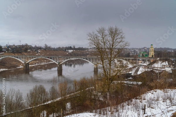 Fototapeta March 22, 2024. Russia. Tver region. The bridge over the Volga River in the city of Staritsa.