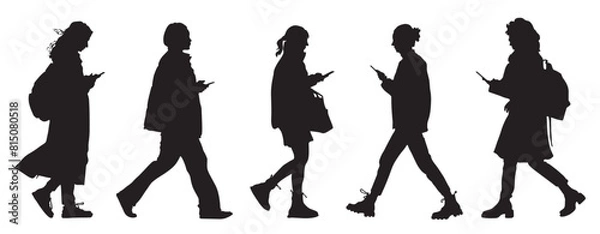 Fototapeta Black silhouettes of walking women using phones on the go. Side view. Isolated on white background. Vector illustration.