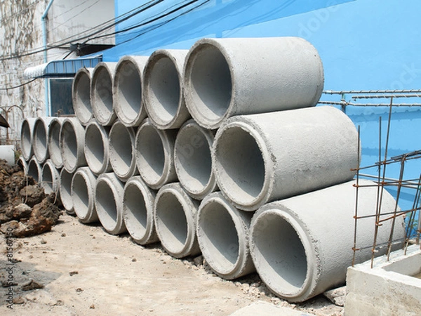 Fototapeta Stacked concrete drainage pipe