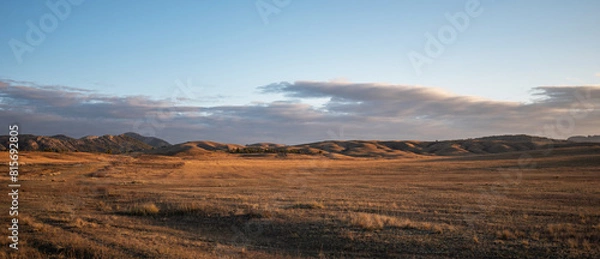 Fototapeta Sunrise on an empty valley amazing hilly landscape. Colorful grassy and hilly natural landscape in autumn. Beautiful autumn scenery in Inner Mongolia, China.