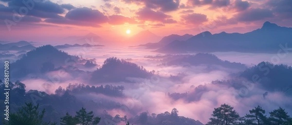 Obraz The first light of dawn breaks over the misty mountains.