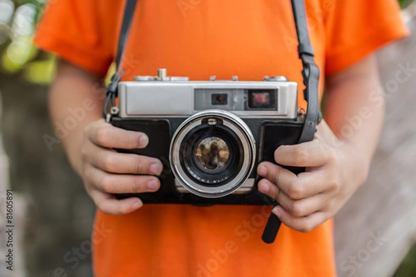 Obraz boy with old camera retro