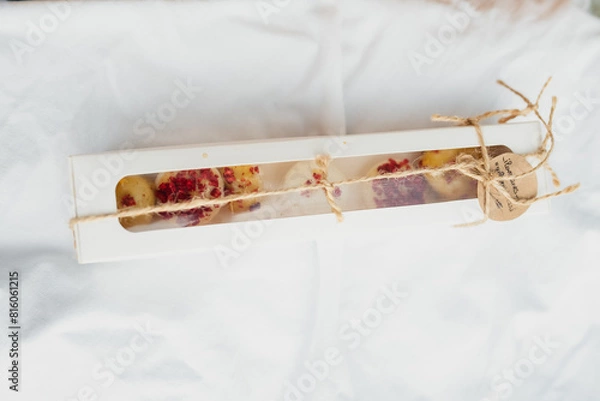 Fototapeta Sweet Berry Delight A box of cookies adorned with fresh