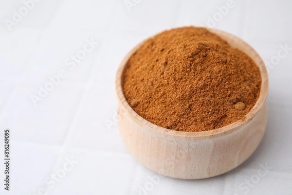 Fototapeta Ground red pepper on white tiled table, closeup. Space for text