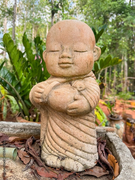 Fototapeta The neophyte sculpture with 
smilingly face in a happiness and peaceful emotion.