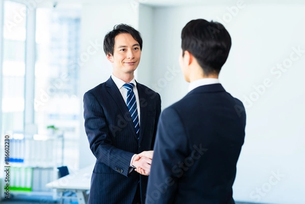 Fototapeta 握手するビジネスマン