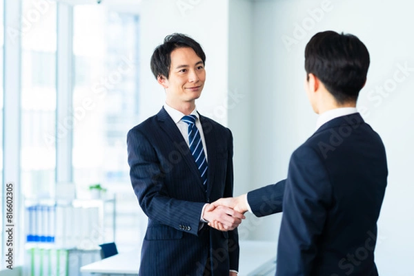 Fototapeta 握手するビジネスマン