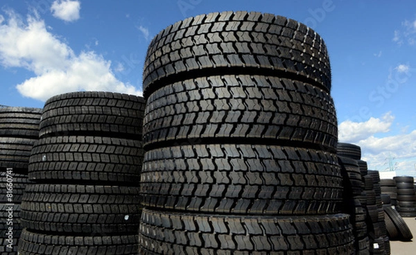 Obraz tires stacked in a yard