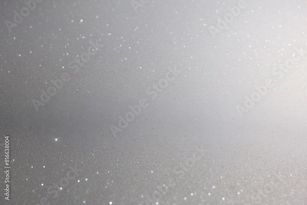 Fototapeta Silver sparkle background with areas of bokeh effect, creating a blurred glitter texture