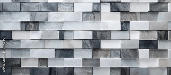 Fototapeta Abstract background of white grey and black ceramic mosaic wall tiles provides a textured and visually appealing option for bathroom decor This top view composition offers ample copy space for additi